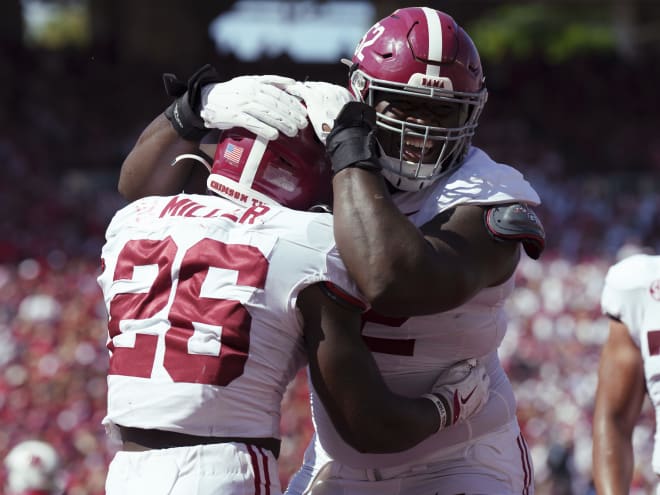 Where does Alabama rank in the polls after its road win over Wisconsin?