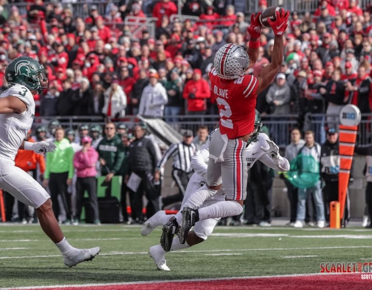 Chris Olave of the Ohio State Buckeyes celebrates after a touchdown