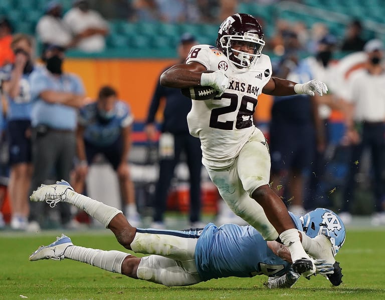 Top running backs in the 2022 NFL Draft include Isaiah Spiller, Breece Hall