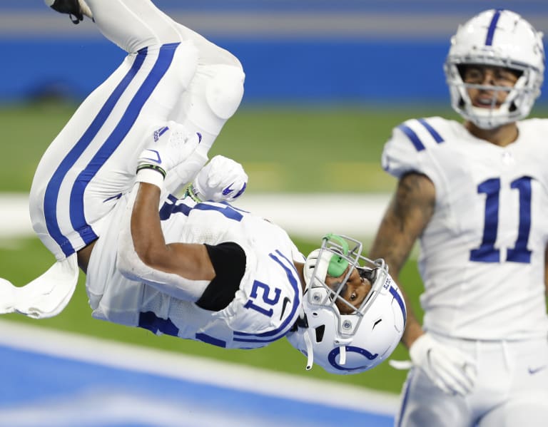 Indianapolis Colts' Nyheim Hines, left, and Jacksonville Jaguars