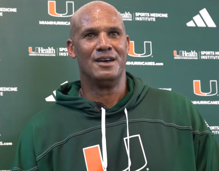 Miami coaches Jason Taylor and Derek Nicholson talk post practice ...