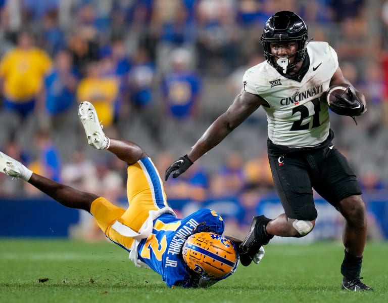 Kiner runs for 153 yards as Cincinnati holds off Pitt 27-21