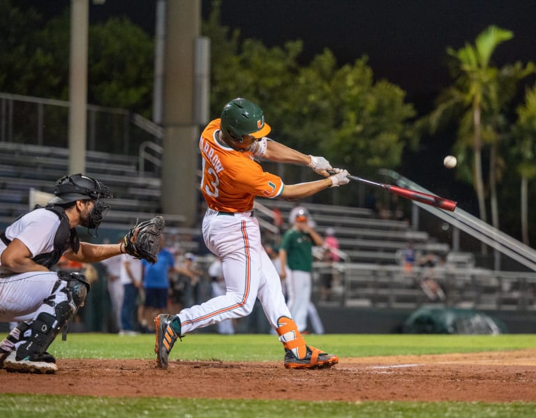 Miami outfielder Dario Gomez runs to first base after singling to