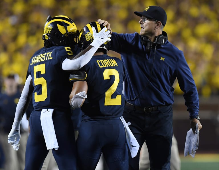 Jim Harbaugh calls Michigan president to say he's staying