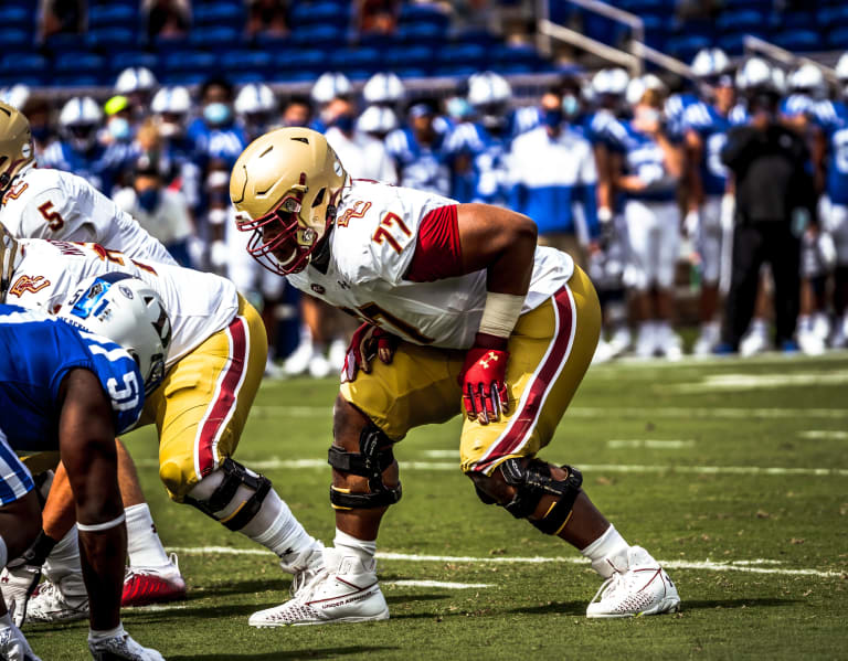 Boston College offensive guard Zion Johnson holds a team jersey