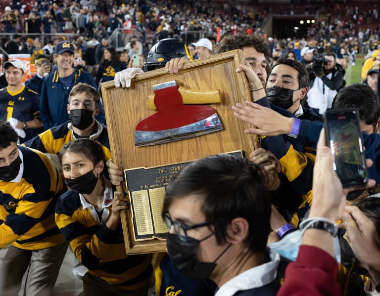 Cal players and fans celebrate with the Stanford Axe after beating hated rival Stanford