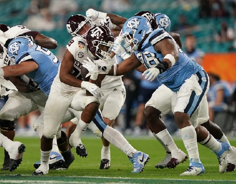 From Hoops To The Gridiron, UNC DL Kevin Hester Is Catching On