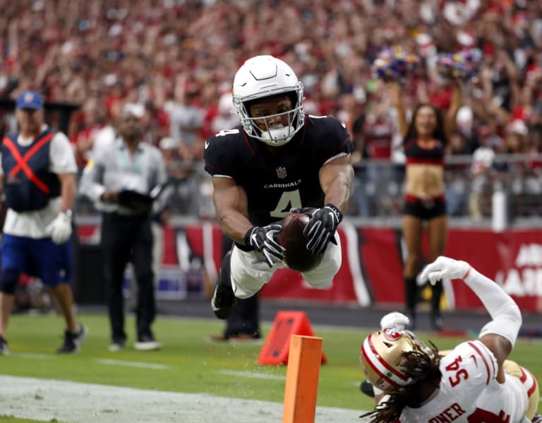 Covering his face with his hand, the Cardinals rookie speedster