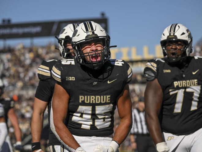 Mockobee climbing Purdue rushing ladder after off-season work