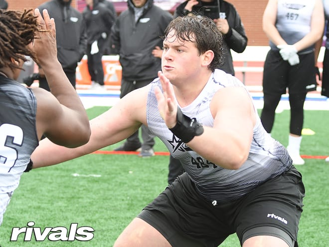 Four-star OL commit reclassifies