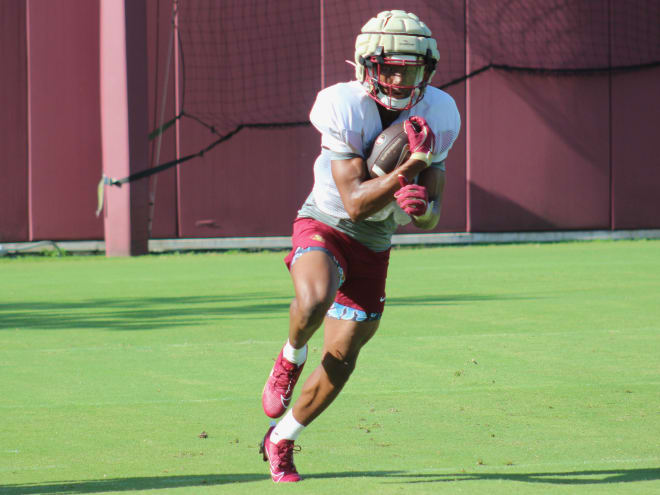 Two-sport stars Danzy, Gibson juggling time as football practice begins