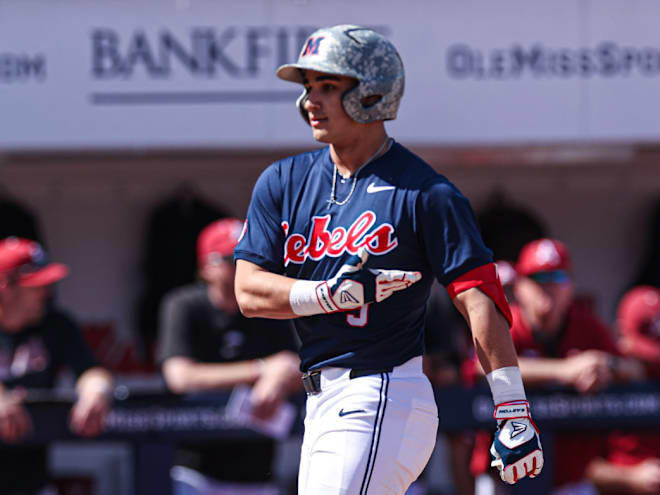 Rebels score in bunches to beat Arkansas in SEC opener