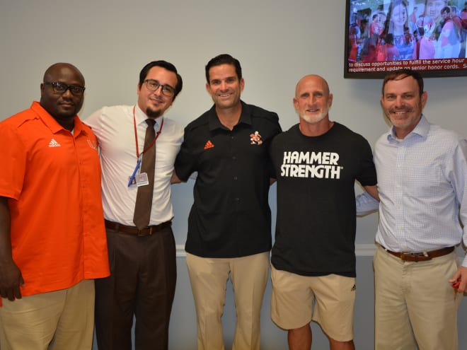 Diaz assesses State of the U during visit with Cardinal Gibbons coaches