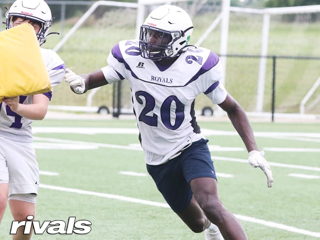 DE came to U.S. for hoops, stars in football & lands UM offer