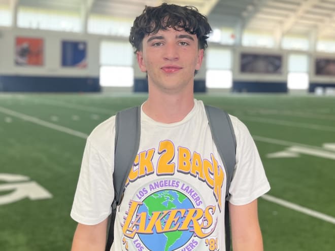 Joe Sloan visits with two four-star recruits on Monday