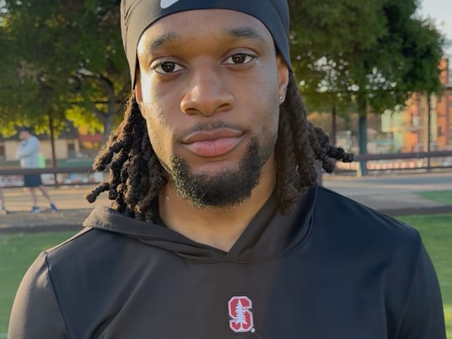 Stanford DB Jay Green fends off a bee at spring practice