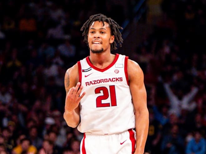 Arkansas knocks off No. 14 Michigan at Madison Square Garden