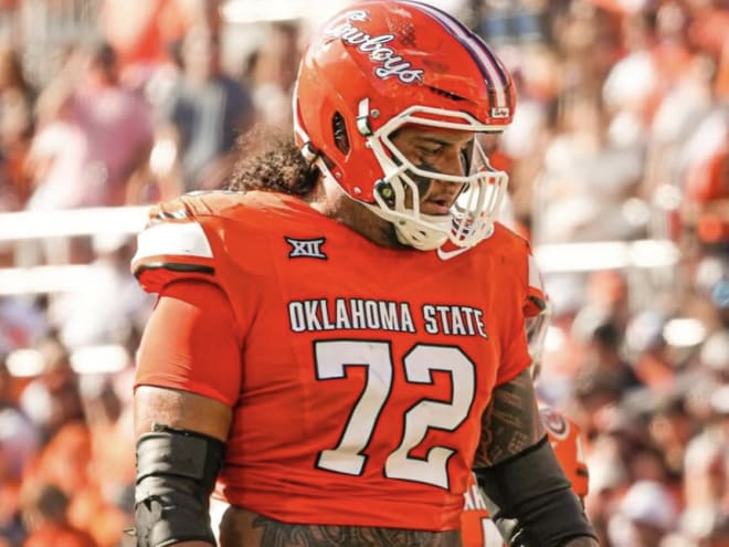 Oklahoma State transfer tackle visiting Arkansas