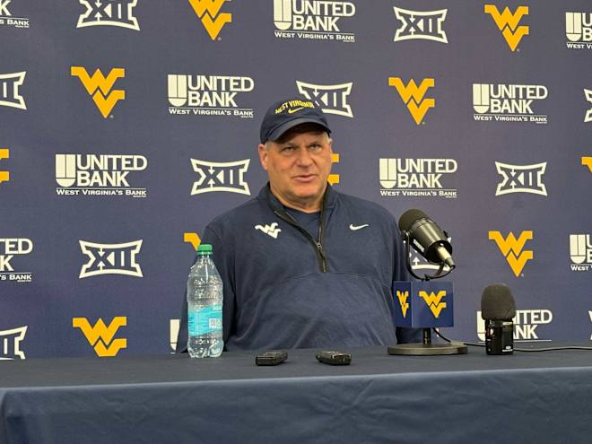 West Virginia wants continued competition at quarterback