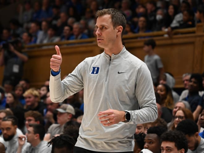 Jon Scheyer felt like movie character, having to watch team from afar