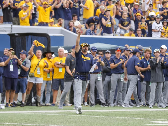 Neal Brown gets ready for Oklahoma State game during weekly radio show