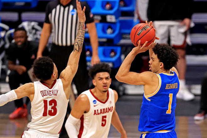 UCLA Bruins guard Jules Bernard (1) shoots the ball against Alabama Crimson Tide guard Jahvon Quinerly (13) during the first half in the Sweet Sixteen of the 2021 NCAA Tournament at Hinkle Fieldhouse. Photo | Imagn