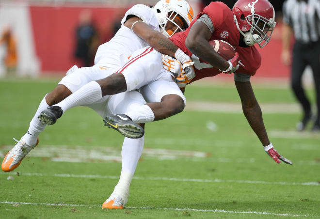 Tennessee Volunteers defensive back Shawn Shamburger (15) lifts up Alabama Crimson Tide wide receiver Calvin Ridley (3) for the tackle during the first quarter at Bryant-Denny Stadium. Photo | USA Today