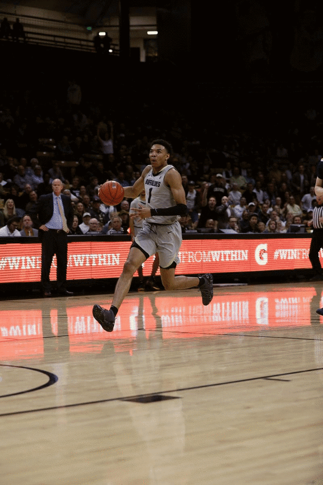 Tyler Bey slam dunks the ball following a steal in the second half of Colorado's 69-53 win over UC Irvine.