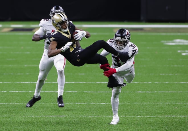 New Orleans Saints wide receiver Michael Thomas (13) catches a pass over Atlanta Falcons free safety Ricardo Allen (37) during the second half at the Mercedes-Benz Superdome.