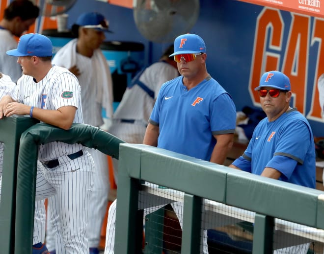University of Florida head coach Kevin O'Sullivan, center, watches after a inning ending strikeout as the Gators play the University of South Florida during the Gainesville Regional of the 2021 Division 1 Baseball Championship, at Florida Ballpark on the University of Florida campus in Gainesville Fla. June 4, 2021.