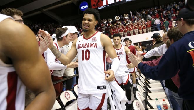 Alabama guard Dom Welch (10) reacts as he high fives fans following the game with Mississippi State at Coleman Coliseum. Photo | Gary Cosby Jr.-Tuscaloosa News / USA TODAY NETWORK