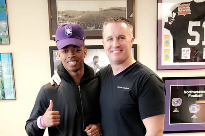 Pat Fitzgerald with 2018 Northwestern commitment Greg Newsome.