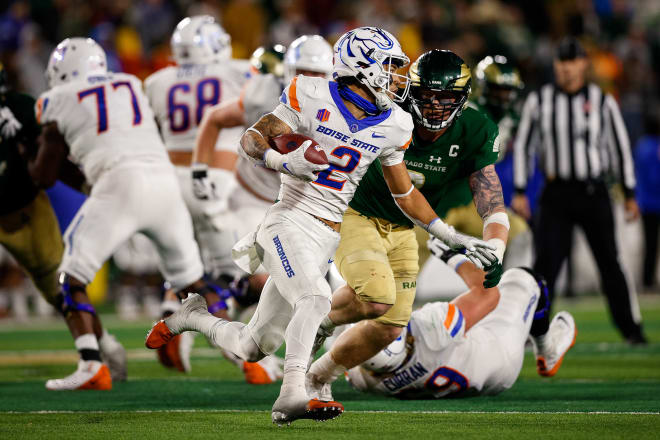 Oct 30, 2021; Fort Collins, Colorado, USA; Boise State Broncos wide receiver Khalil Shakir (2) runs the ball as Colorado State Rams defensive lineman Toby McBride (0) defends in the fourth quarter at Sonny Lubrick Field at Canvas Stadium. Mandatory Credit: Isaiah J. Downing-USA TODAY Sports