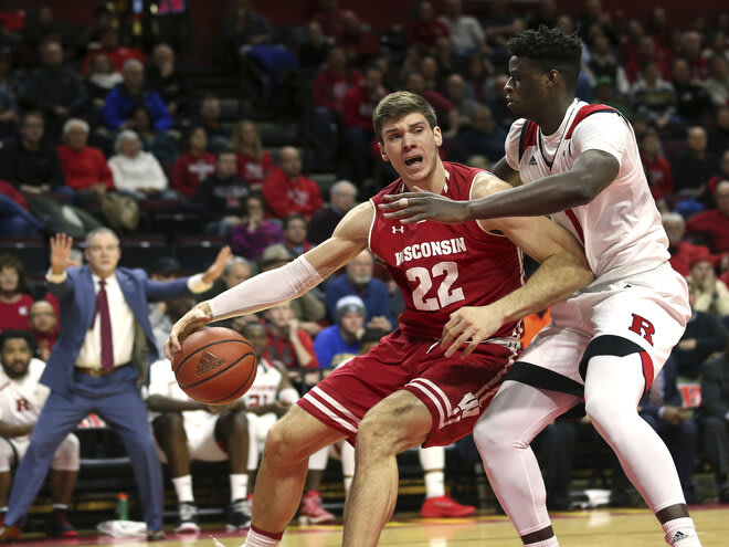 Wisconsin's Ethan Happ (22) dribbles the ball as Rutgers' Candido Sa in 2018. Rutgers won the first three Big Ten meetings between the schools in New Jersey.