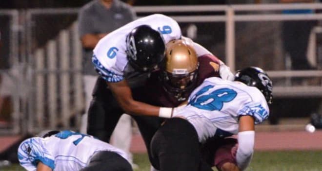 Kukea Emmsley (#6) makes the tackle 