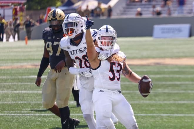 UTSA Linebacker Caleb Cantrell celebrates after recovering a fumble at the Army one yard line to set up a UTSA touchdown.