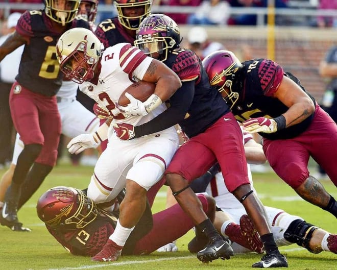 FSU's defense wraps up Boston College running back A.J. Dillon in last year's game.