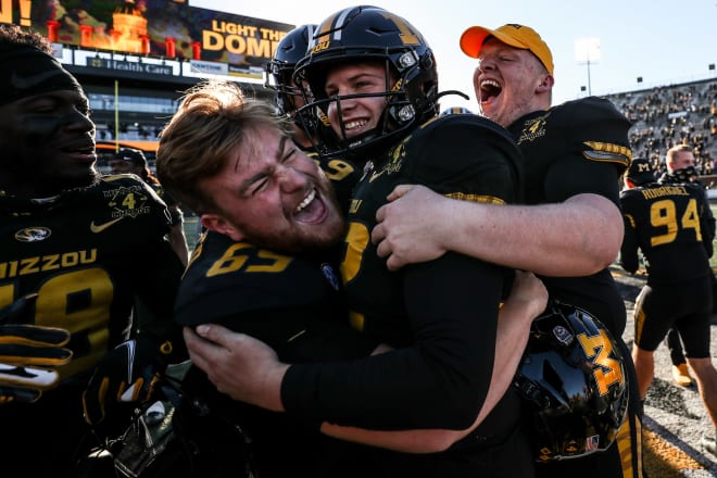 Kicker Harrison Mevis celebrates with teammates after making the game-winning field goal against Arkansas.