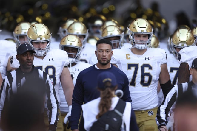 Notre Dame coach Marcus Freeman and the Irish took care of business on Saturday, eventually, with a 56-23 romp over host Stanford.