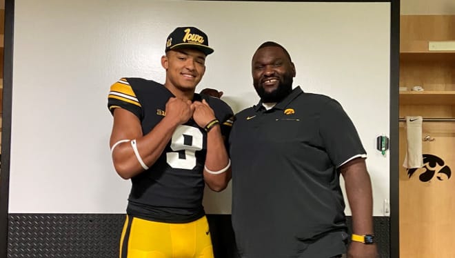 Defensive end Jordan Allen with Iowa defensive line coach Kelvin Bell on his official visit.