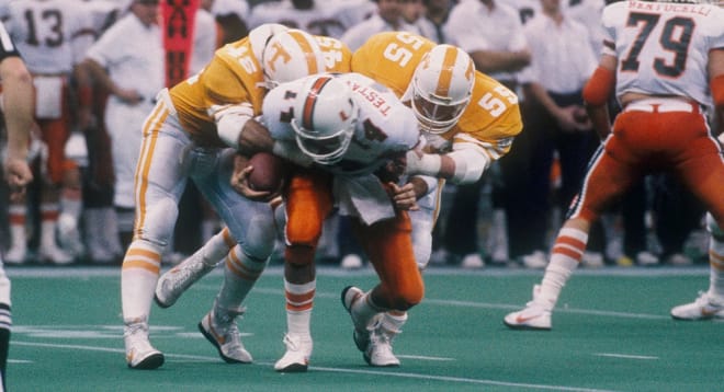 Tennessee defenders swarm Miami quarterback Vinny Testaverde in the Sugar Bowl on Jan. 1, 1986.