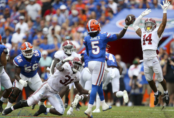 Alabama Crimson Tide defensive back Brian Branch (14) blocks a fourth down pass by Florida Gators quarterback Emory Jones (5) as Crimson Tide linebacker Will Anderson Jr. (31) pressures at Ben Hill Griffin Stadium. Photo | Gary Cosby-USA TODAY Sports