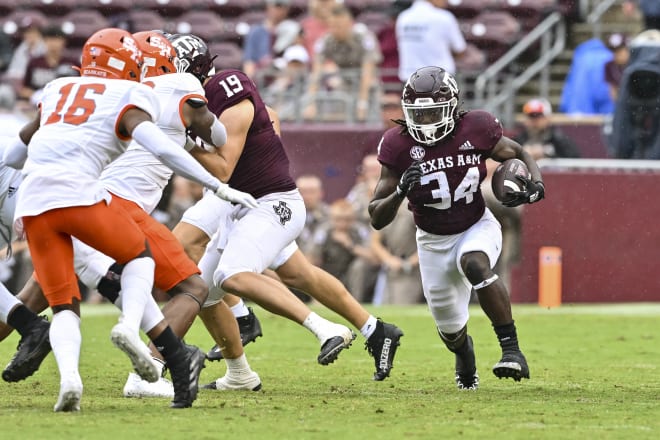 Texas A&M Aggies running back LJ Johnson Jr. (34) carries the ball during the fourth quarter against the Sam Houston State Bearkats at Kyle Field. Photo | Maria Lysaker-USA TODAY Sports