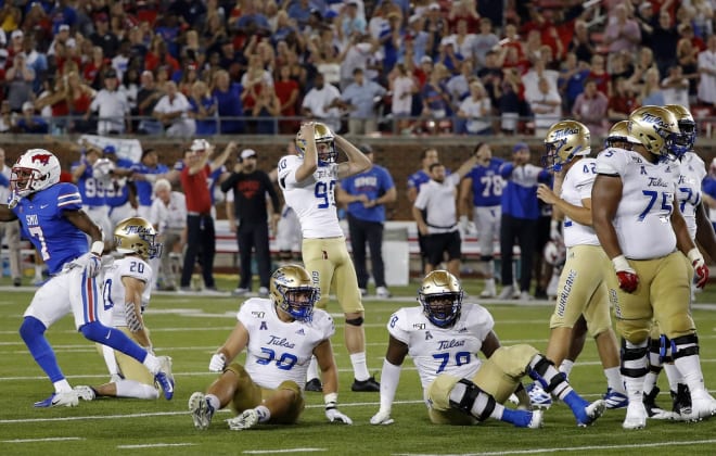 Tulsa kicker Zack Long (90) reacts after missing a field goal in the third overtime.