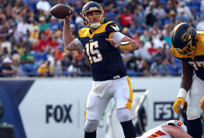 Former Arkansas quarterback Cole Kelley throws a pass for the Memphis Showboats.