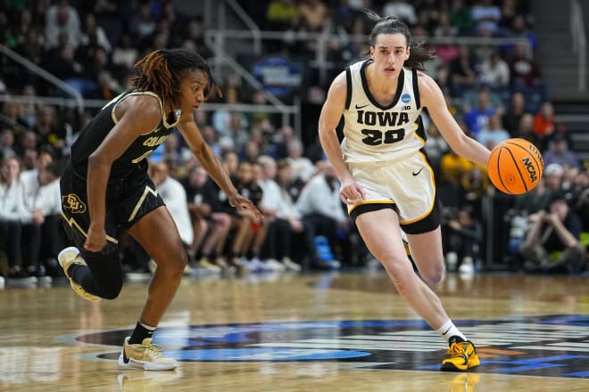 Caitlin Clark dribbles against Colorado guard 