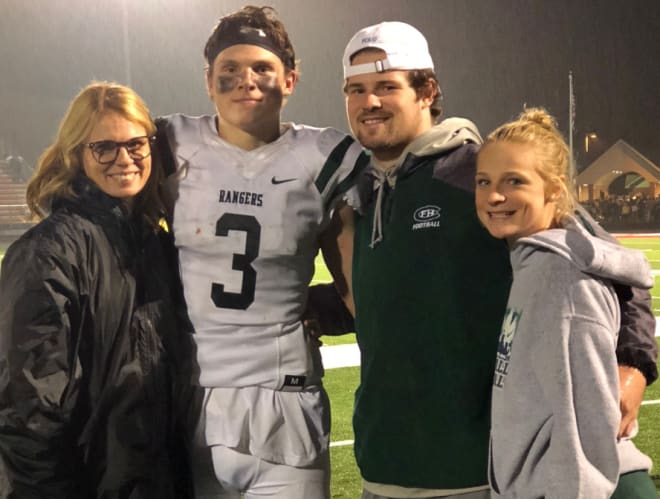 Tate Hallock (No. 3), with mother, Jennifer, brother and MSU walk-on Tanner, and sister Theryn.
