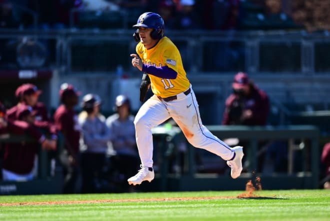 LSU left fielder Josh Pearson scores on a seventh-inning sacrifice fly by catcher Brady Neal fo a 6-4 lead, but the Tigers couldn't hold on in an 8-6 SEC Sunday afternoon road loss at Texas A&M.,