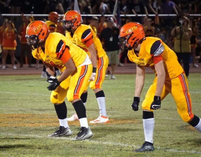The Corona del Sol defense gets into position during a home game against Westview earlier this year.  The Aztecs have made the playoffs for the first time since 2015.  The last time Corona was in the largest-class playoff bracket was in 2008.  The Aztecs travel to East Mesa to face Red Mountain this Friday.  (Photo by Ralph Amsden)