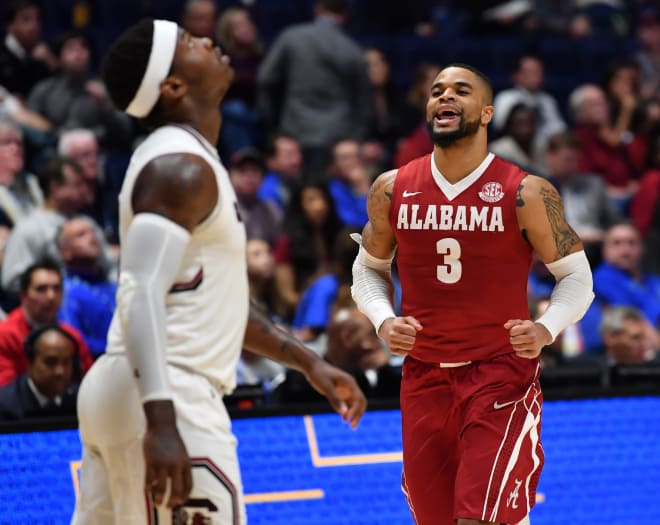Alabama Crimson Tide guard Corban Collins (3) celebrates in the closing seconds of a win over the South Carolina Gamecocks during the SEC Conference Tournament at Bridgestone Arena. Alabama won 64-53. Mandatory Credit: Christopher Hanewinckel-USA TODAY Sports.